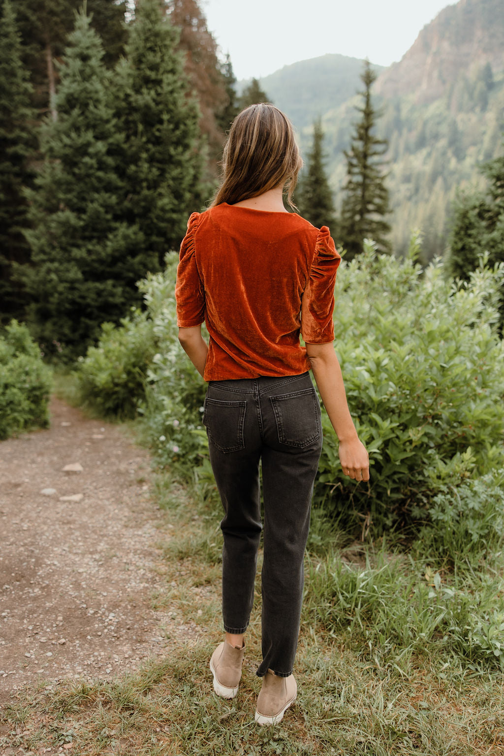 woman wearing red corduroy pants